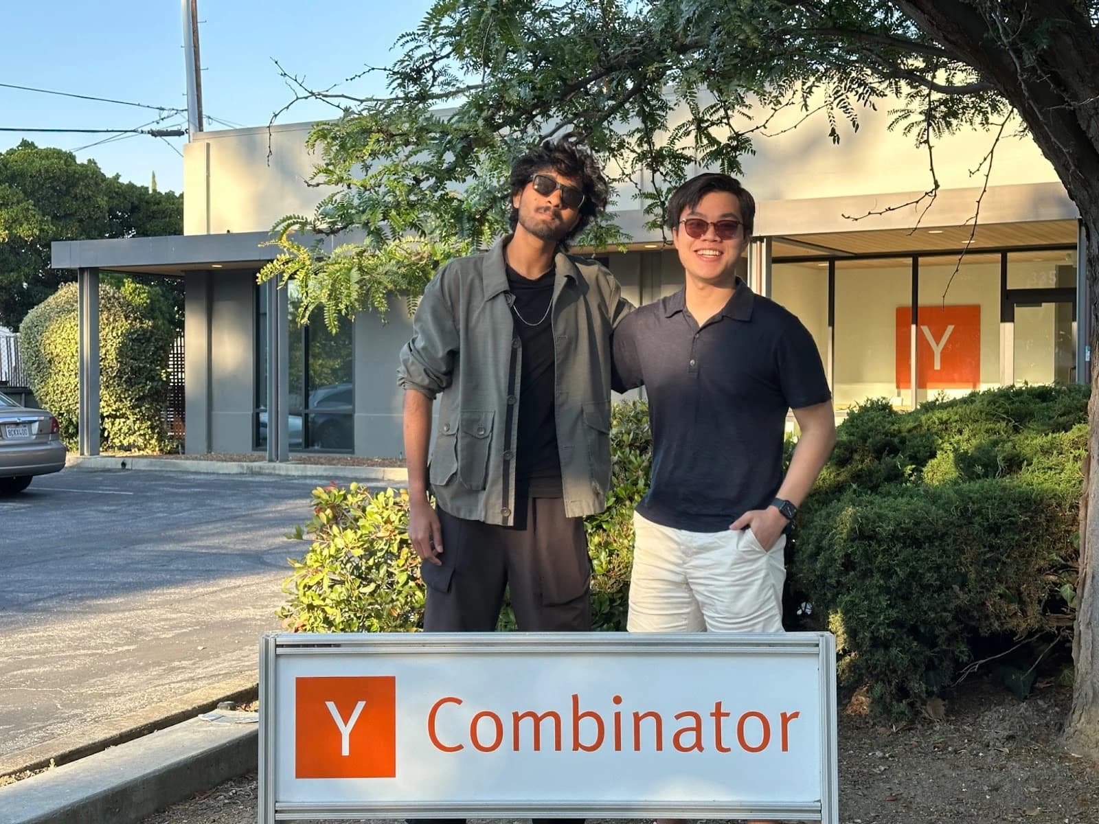Mark Rachapoom and me beside the Y Combinator sign.